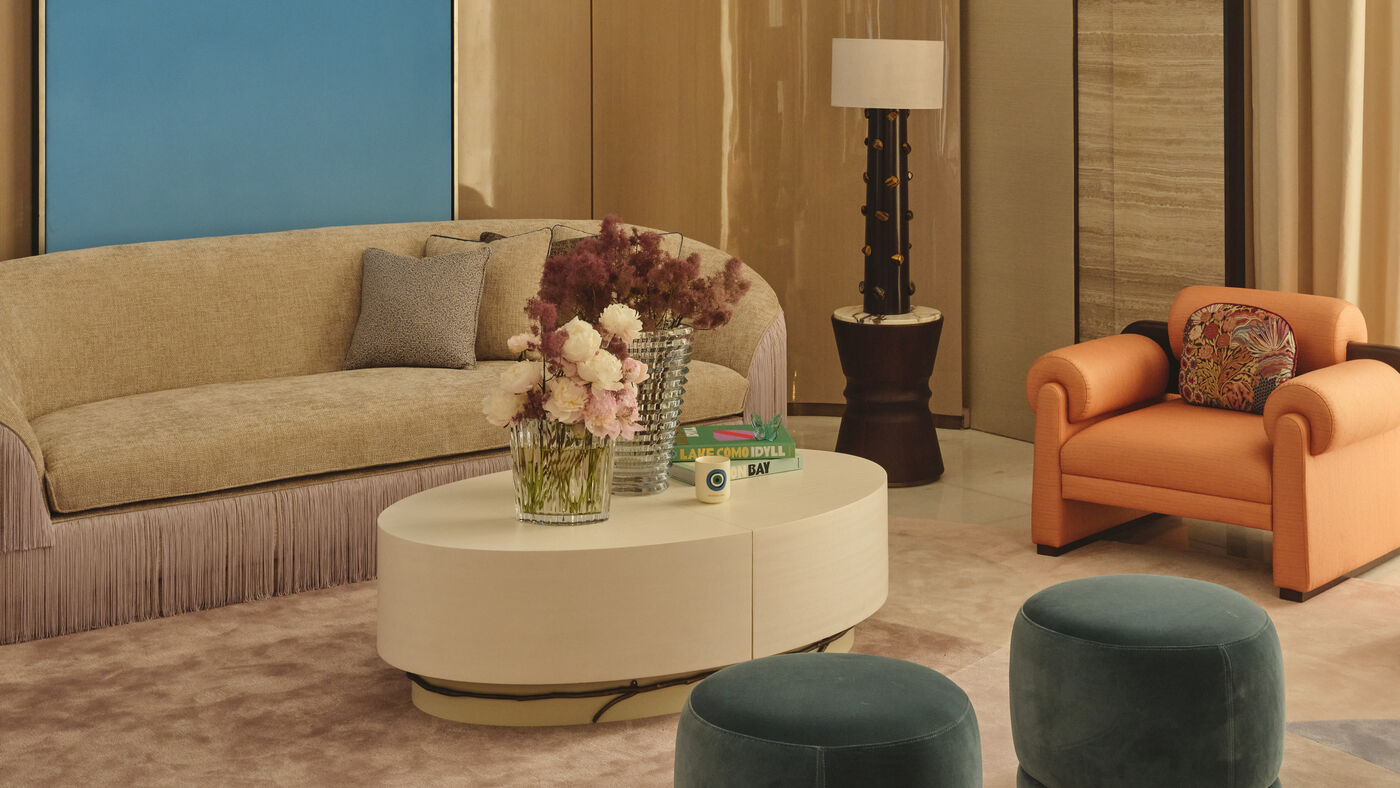 Shmaisi villa lounge, blue panel, orange chair, teal stools